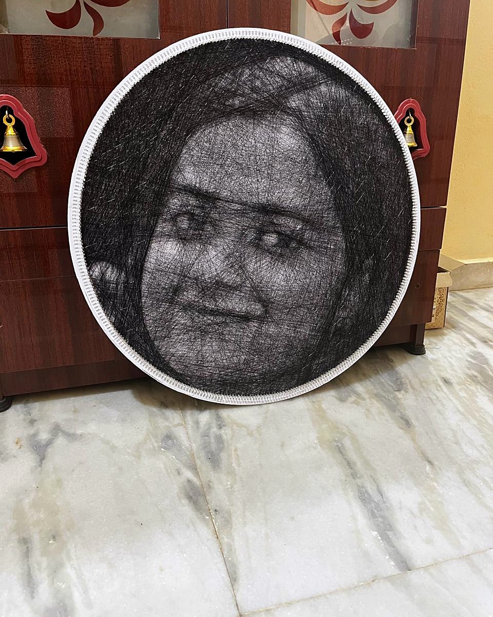 Large circle thread portrait of a woman