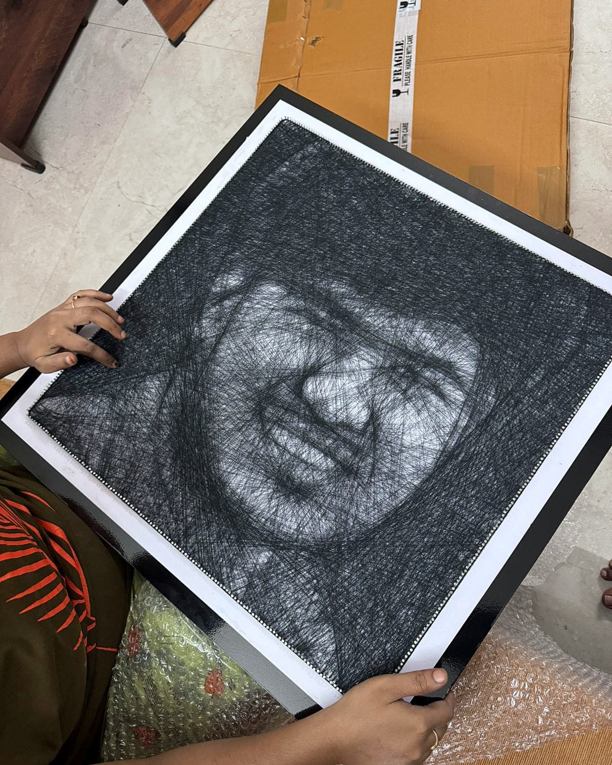 Unboxing a framed thread portrait