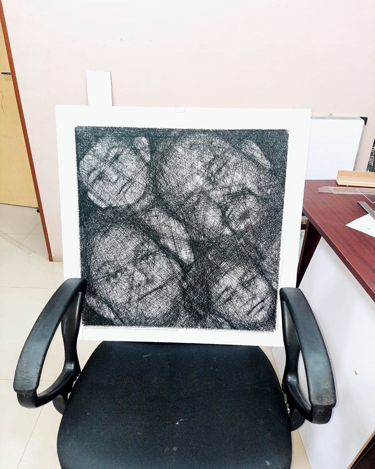 Square thread portrait with four faces